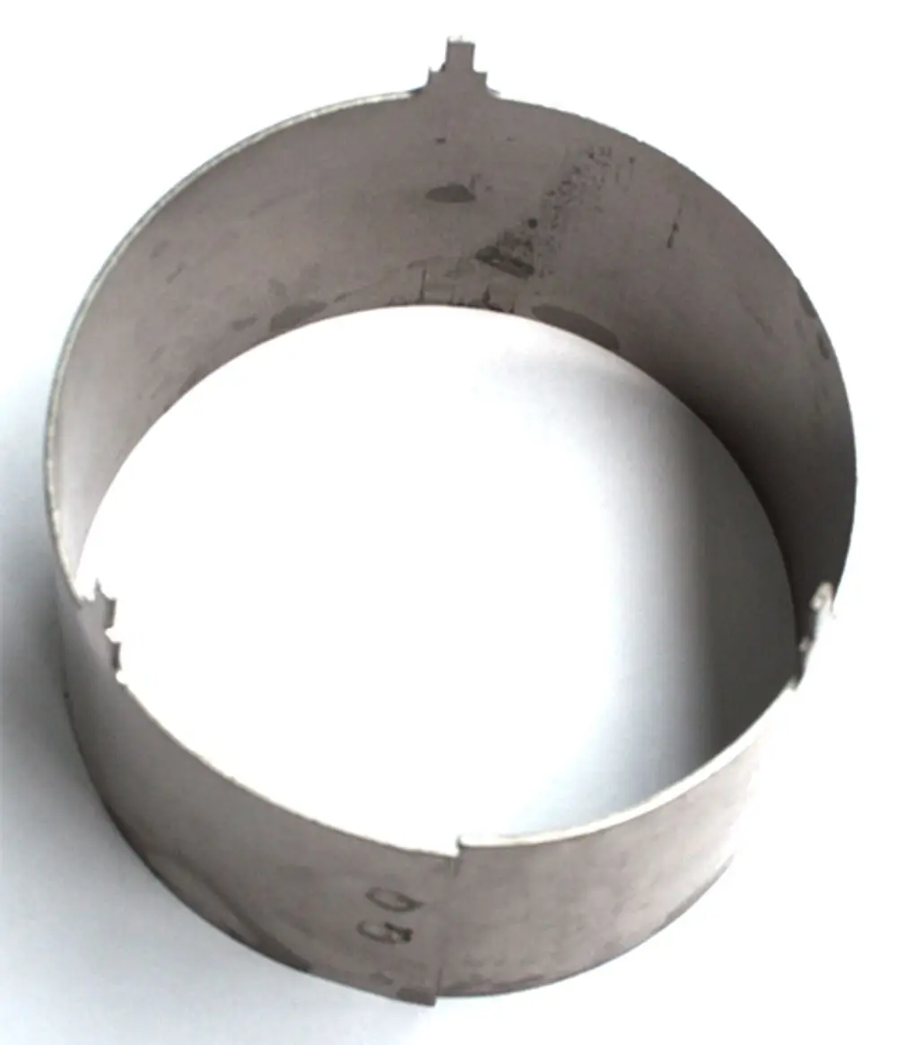 Rohr aus Metall mit runder Form und Schlitz, geeignet für den Einsatz in Heizsystemen, möglicherweise von Daikin, für spezifische Installation.